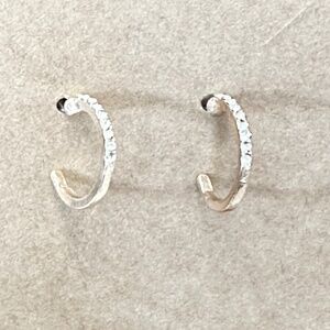 2/$15 Gold tone hoop earrings with clear round crystals on top half. Post back.